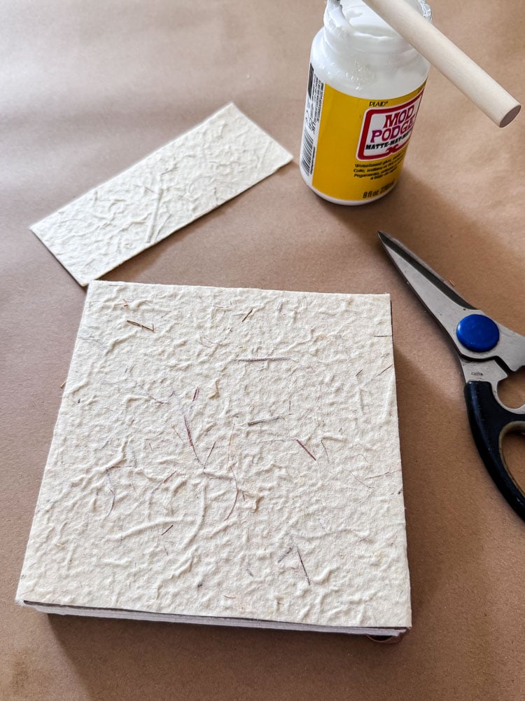 a book, scissors, and glue