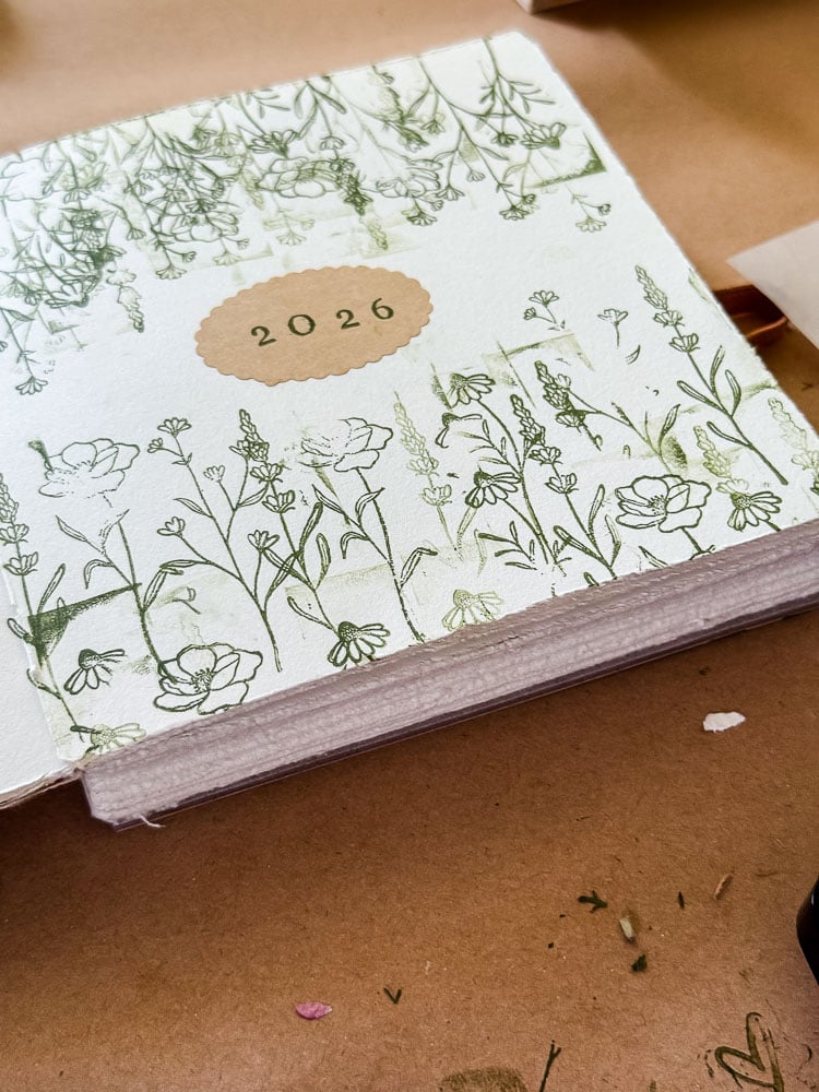 a page stamped with 2026 and green stamped flowers decorating the page