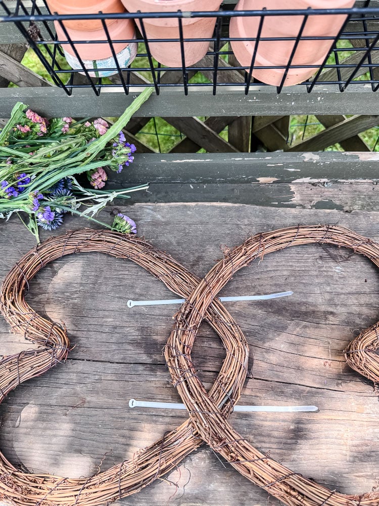 using 2 heart grapevine wreaths to form a butterfly shape
