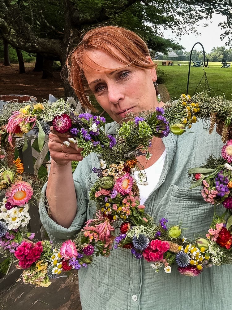 woman holding a butterfly shaped wreath