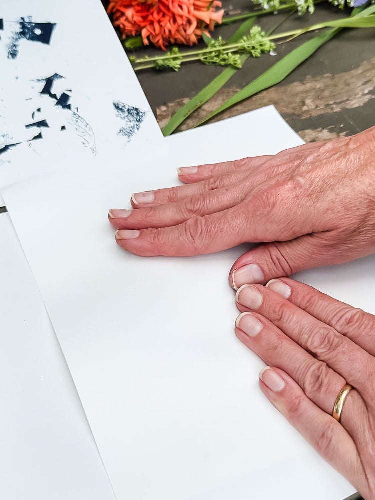 woman's hands on white paper