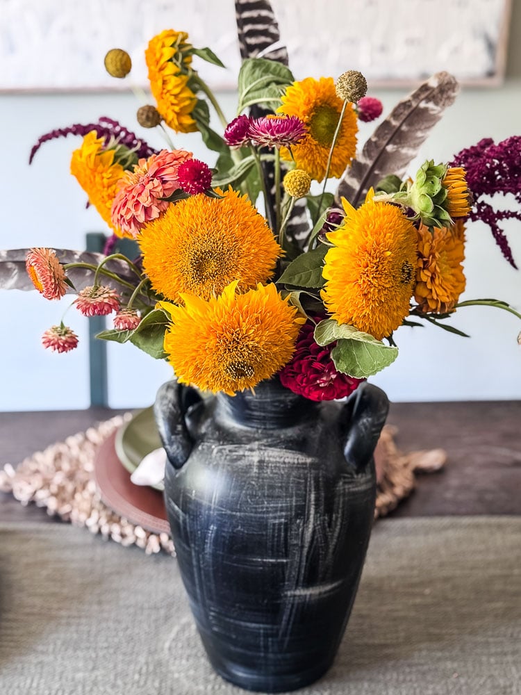 sunflowers in a black vase