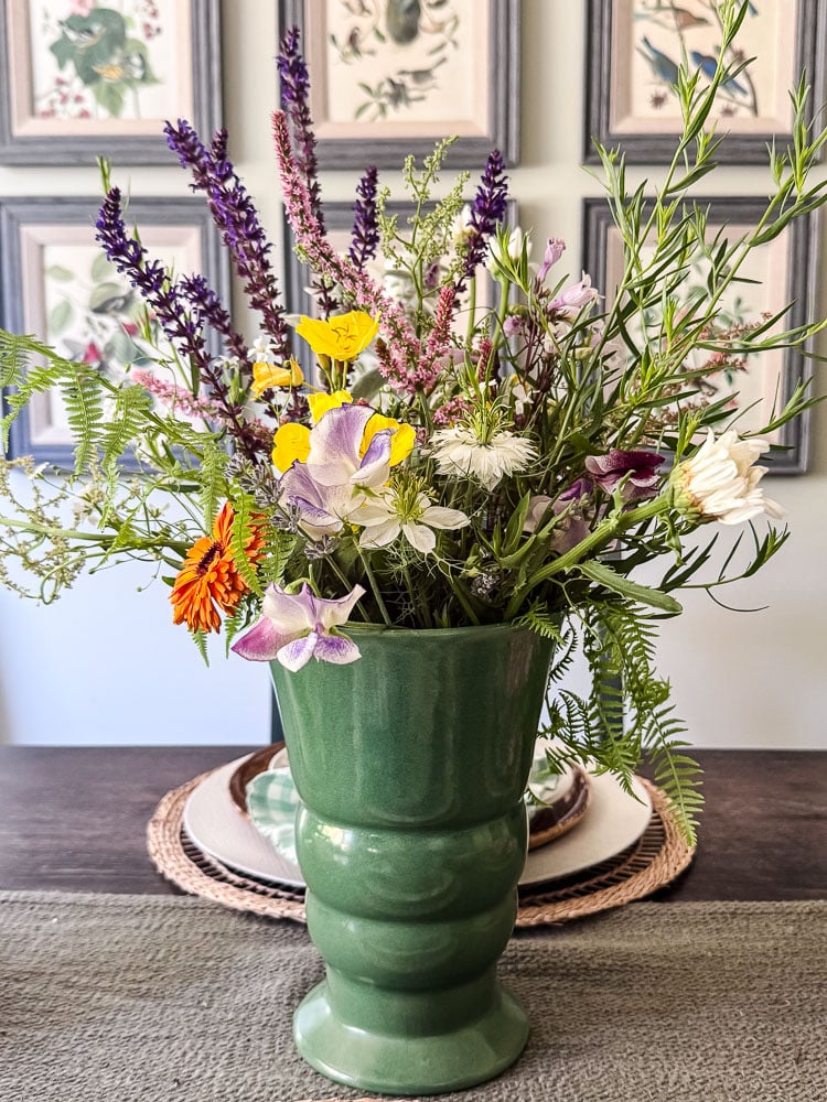 vase of garden flowers on a table