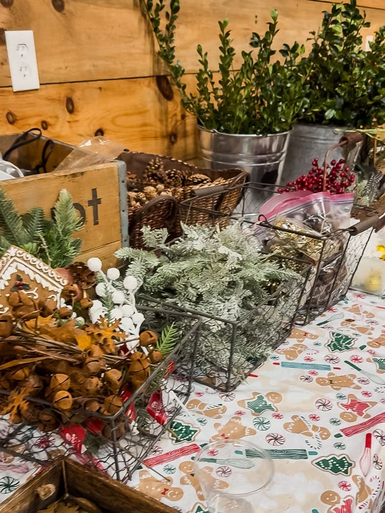 winter wreath decorating supplies on a table